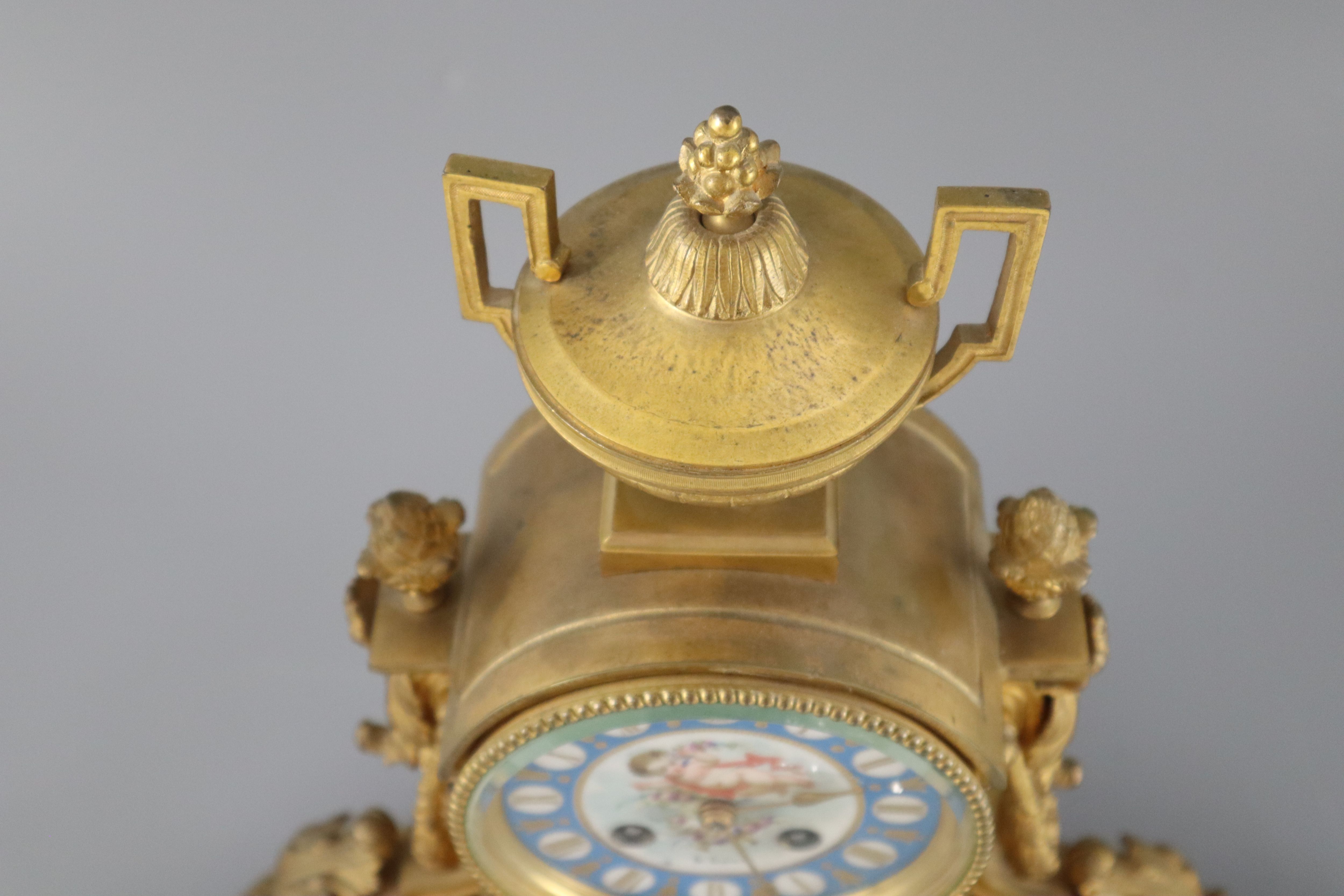 A 19th century Louis XVI style ormolu and Sevres style porcelain clock garniture, height 16.5in.